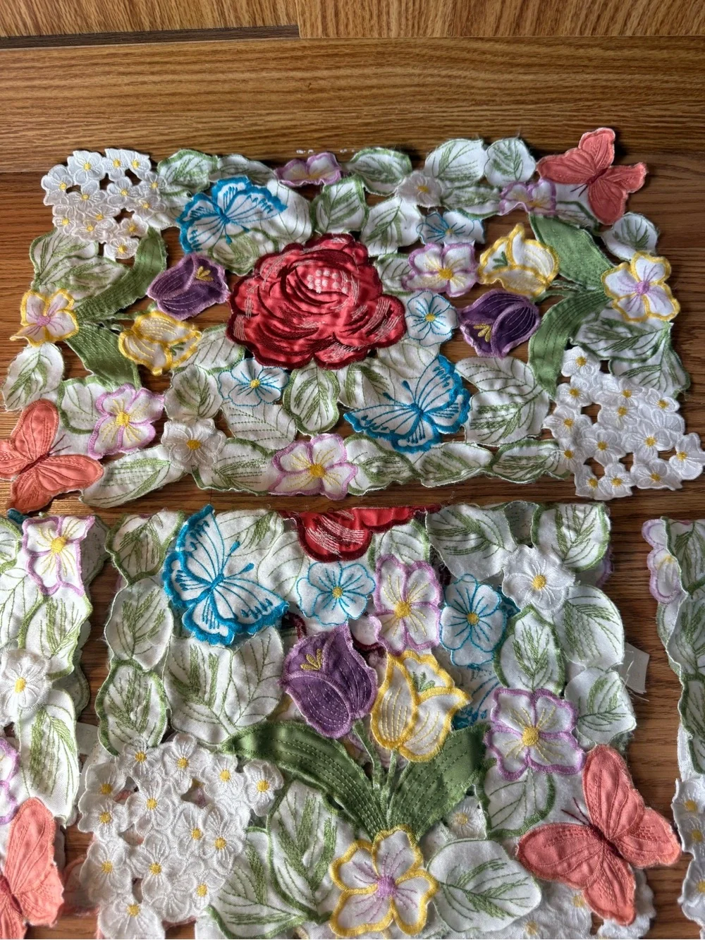Vintage Set of Four multicolor embroidered floral & butterfly cutout placemats